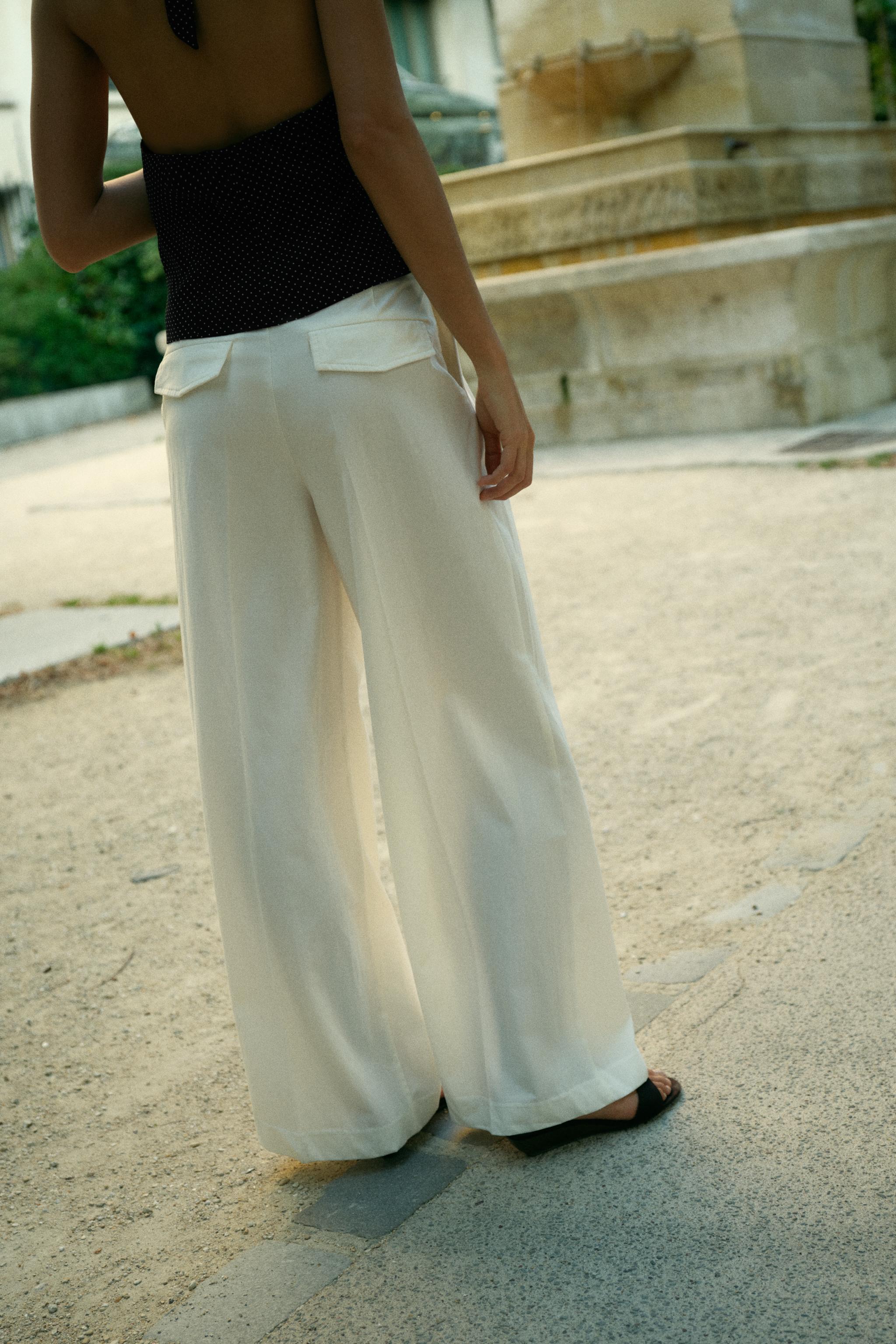 PLEATED PANTS WITH FLAPS
